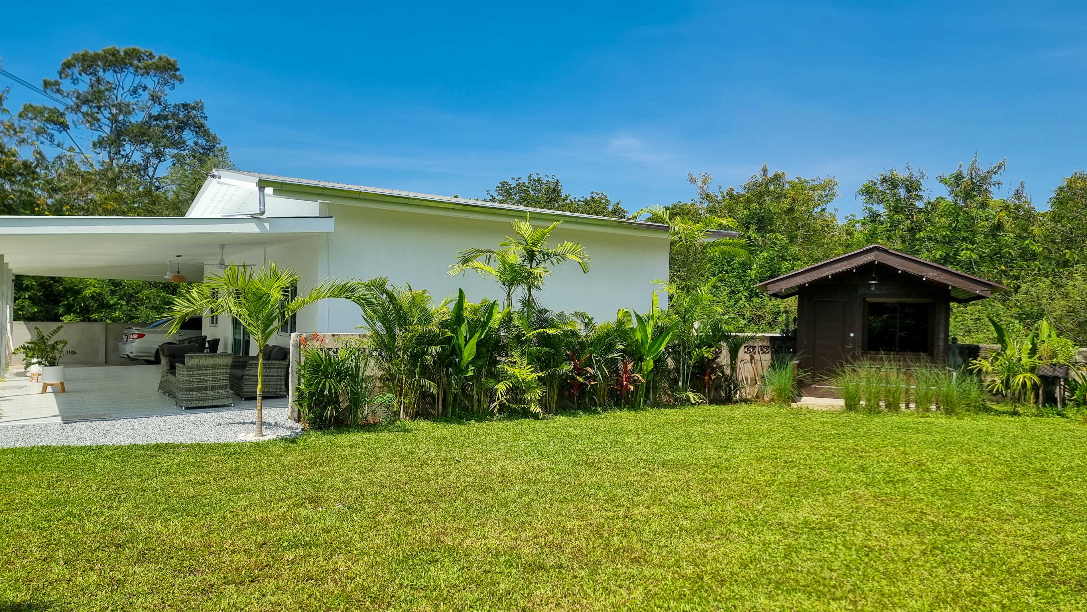 Vacation rental home surrounded by palm trees